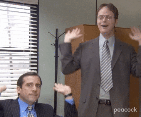a gif of people from the office doing the raise the roof dance
